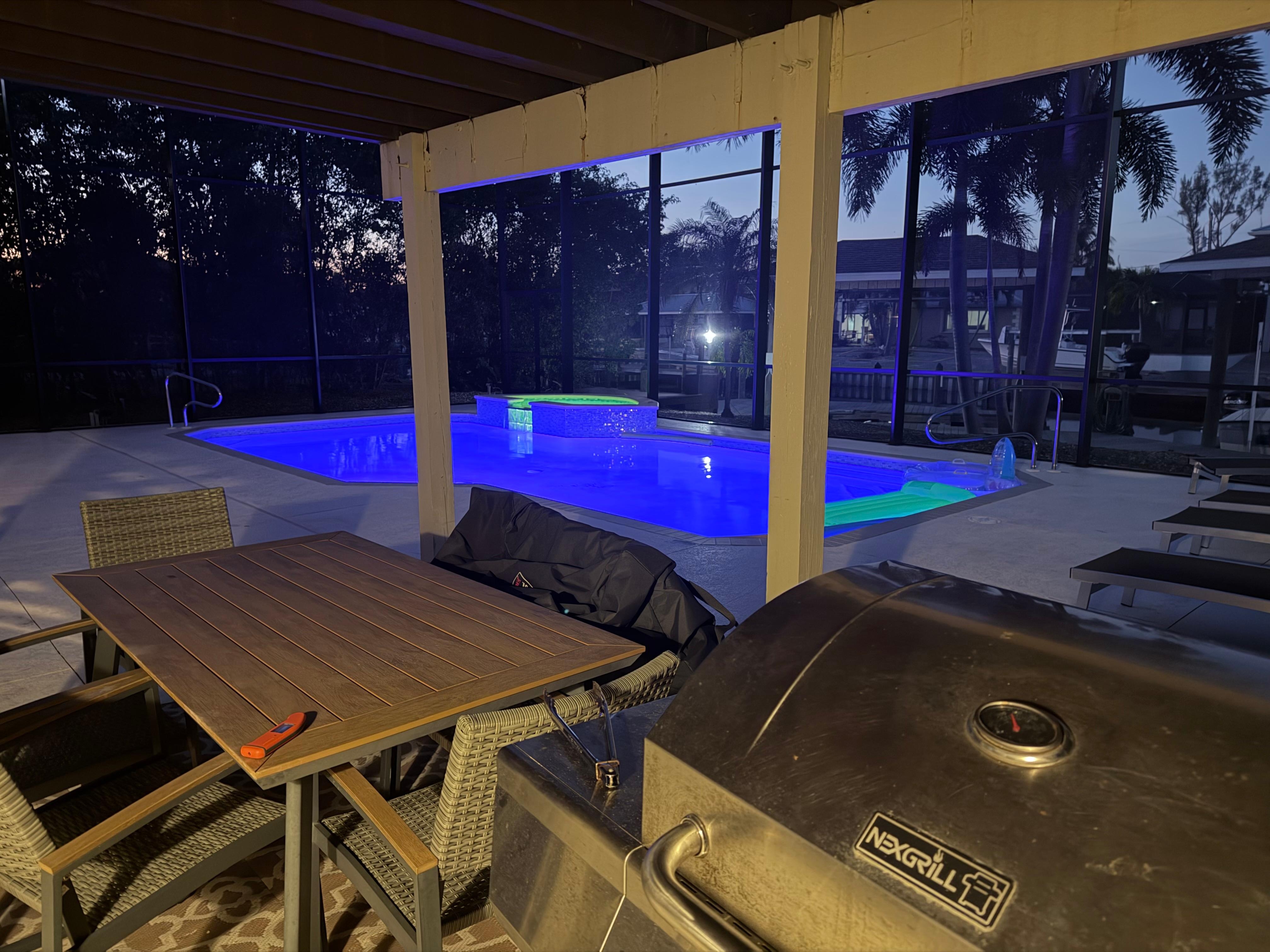 Pool at night from the dining area. 