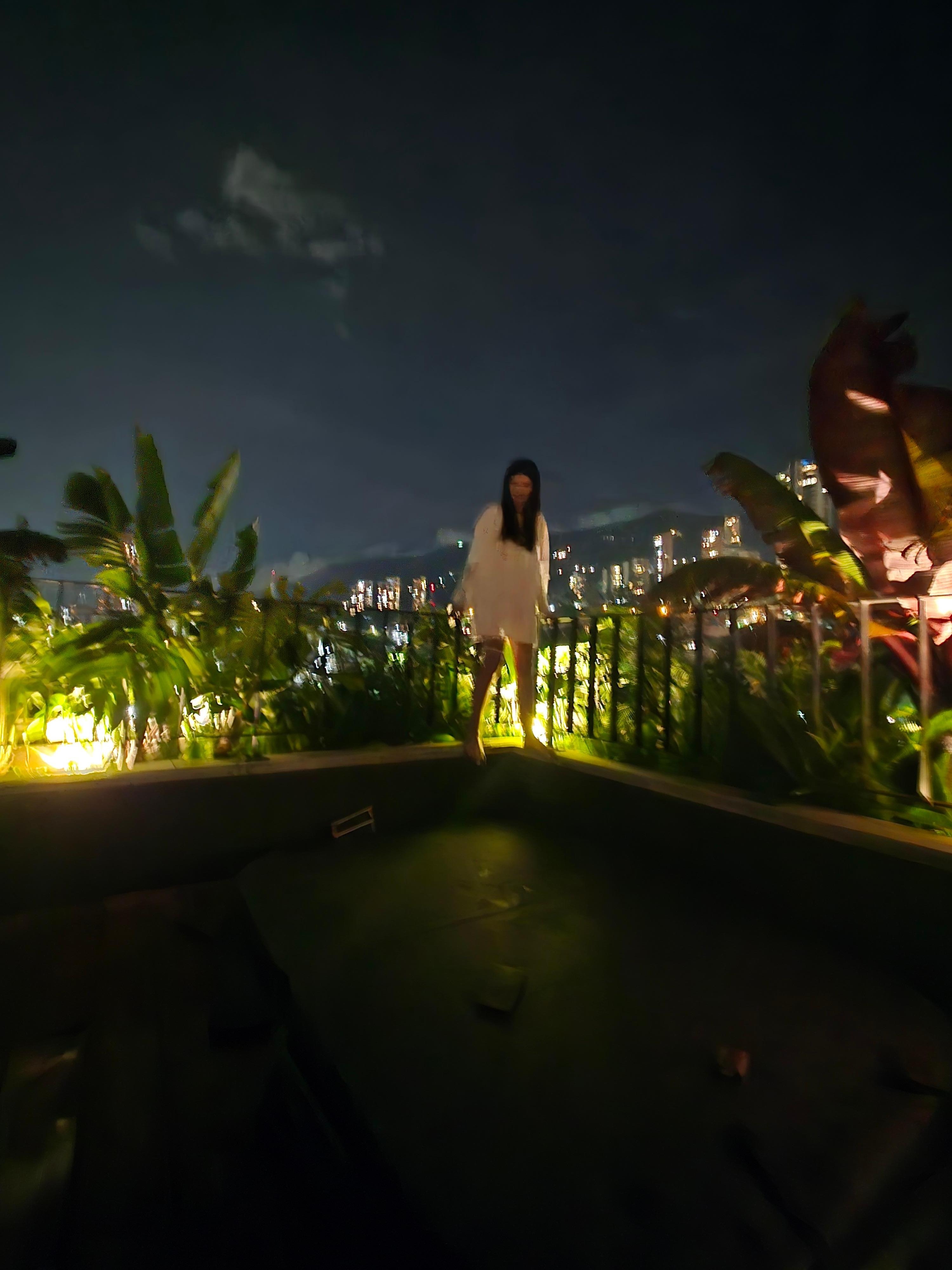 View of the back side of the apartment near the hot tub on the roof. 