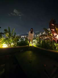 View of the back side of the apartment near the hot tub on the roof.