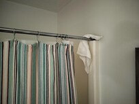 Cleaning rag left on shower curtain