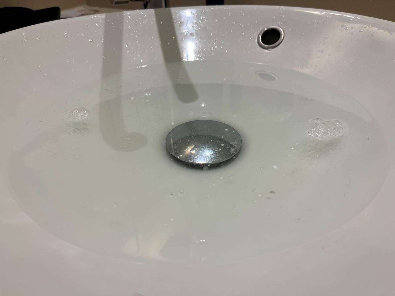 Wash basin drain jammed, water going away very slowly