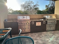 Nice area to sit and visit while grilling supper. Right by the pool.