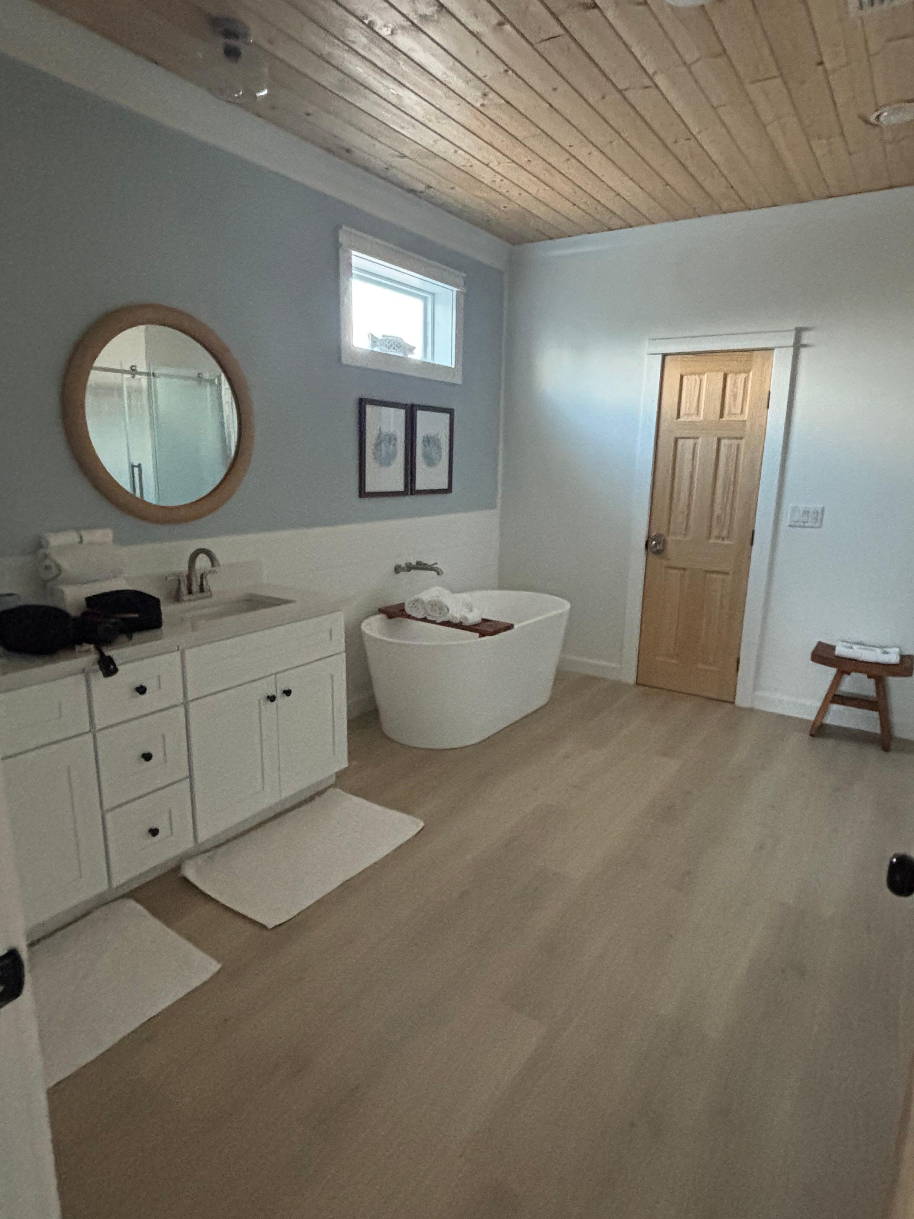 Master bath includes free standing shower.