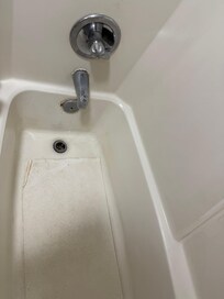 disgusting running faucet & filthy tub