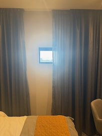 Tiny windows, perfect if you want to keep the room cool, or keep the sun out so you can sleep in!