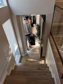 Stairs down to front door