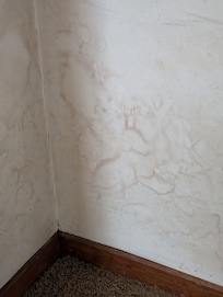 water stained bedroom wall