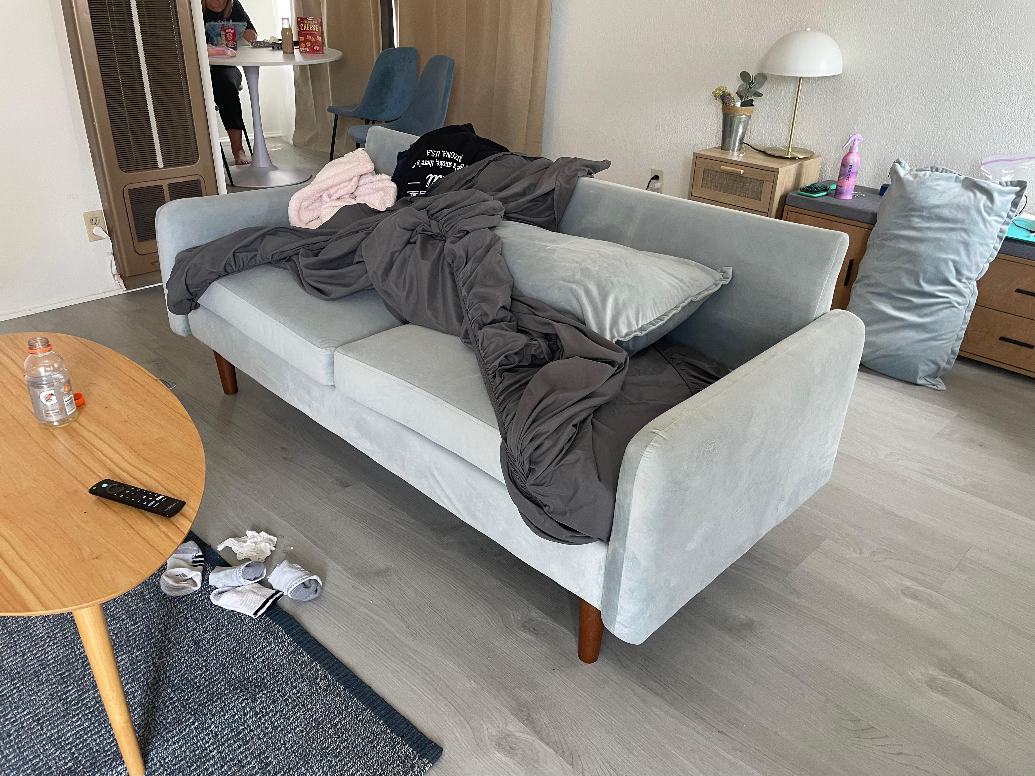 Sofa; does not pull out or fold down.