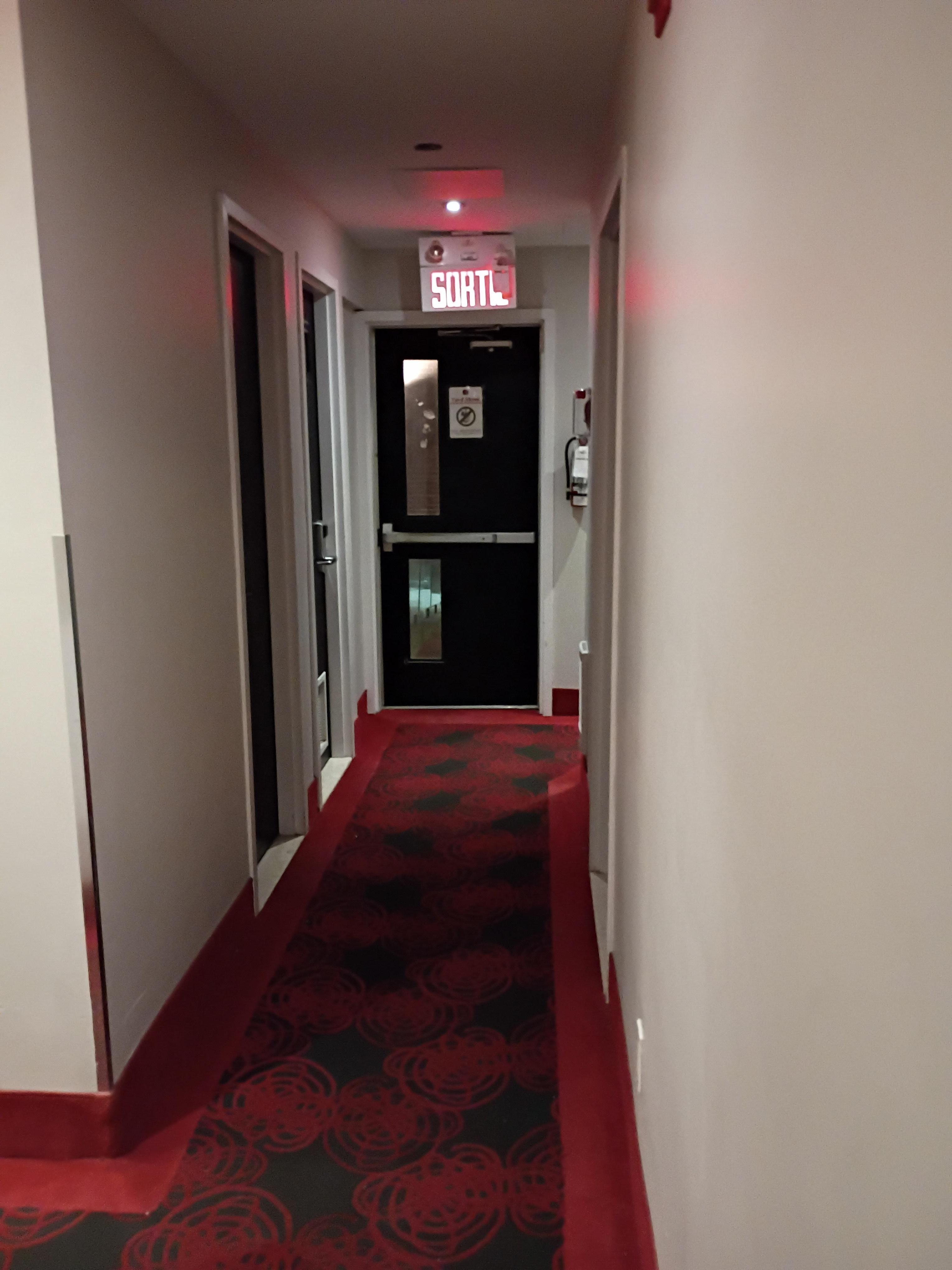 Emergency exits at end of hallway