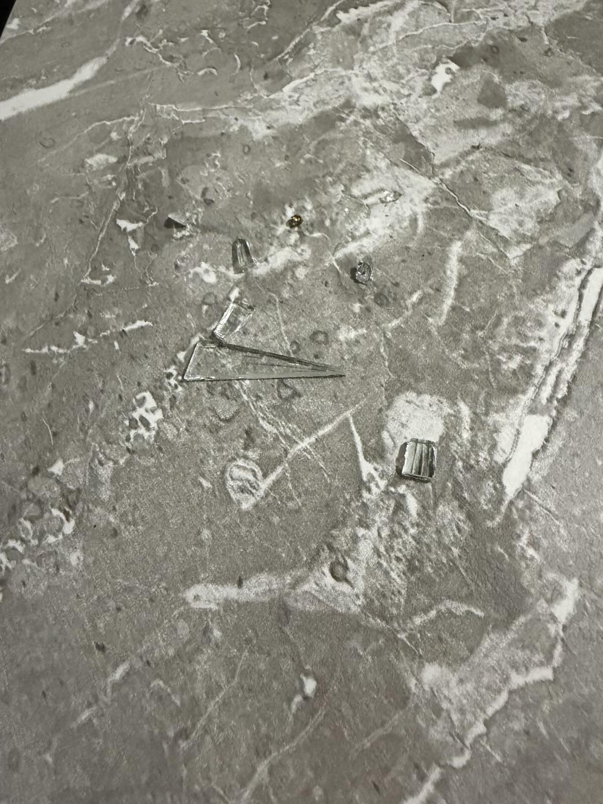 Broken glass left on coffee table. 
