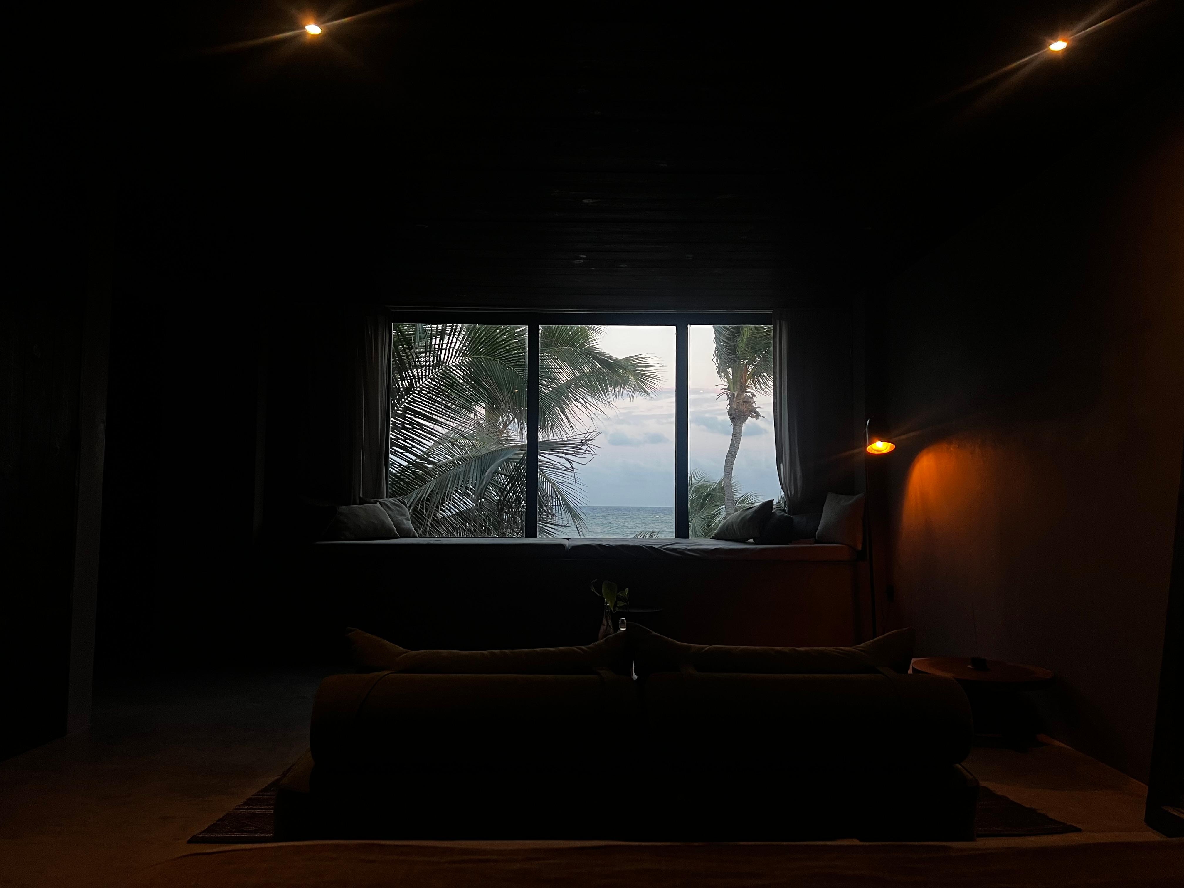 Oceanfront rooftop pool room view at dusk