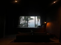 Oceanfront rooftop pool room view at dusk