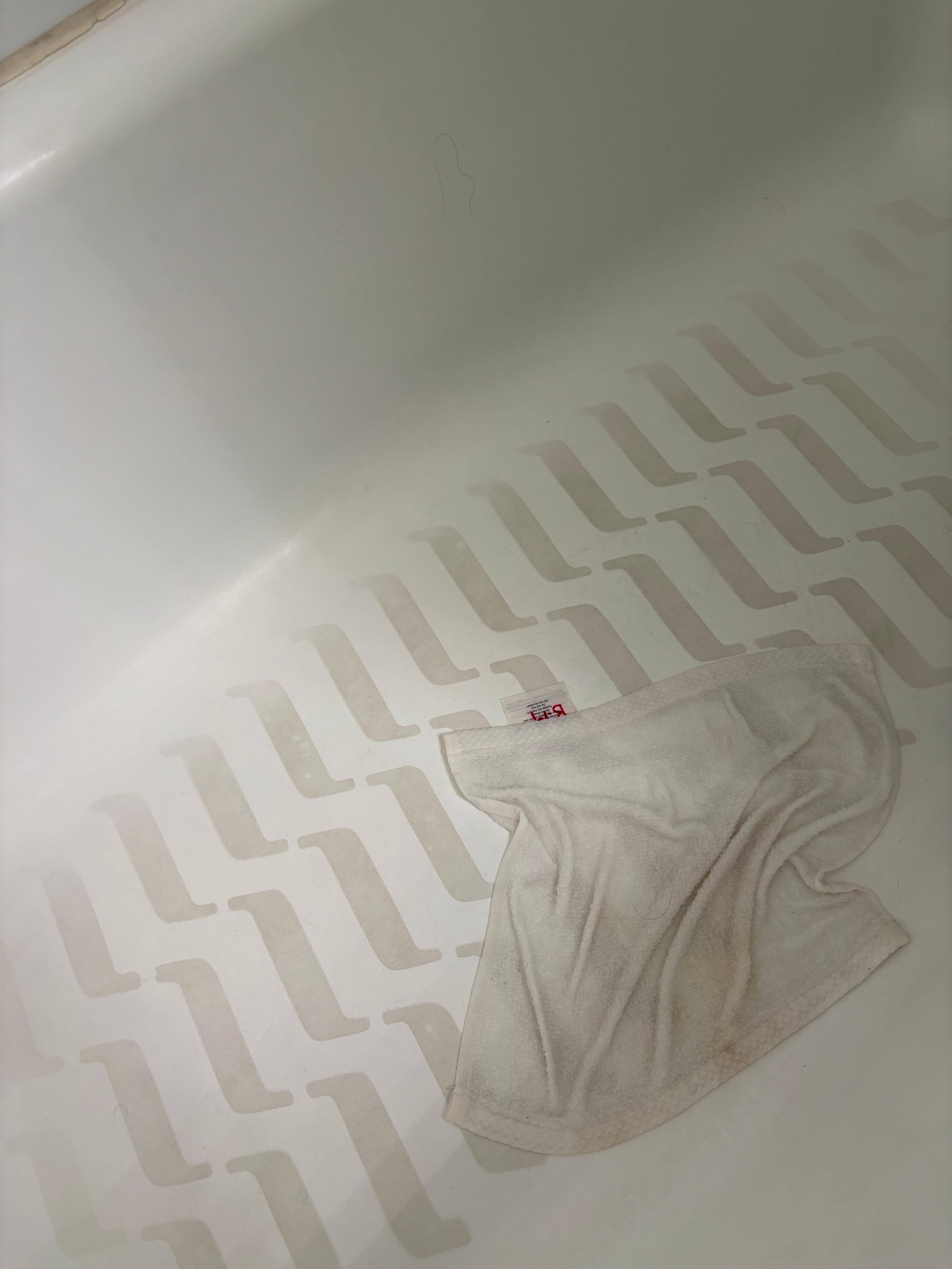 Dirty shower bottom. We had to clean ourselves