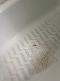 Dirty shower bottom. We had to clean ourselves