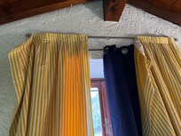 Curtains hanging off the rails