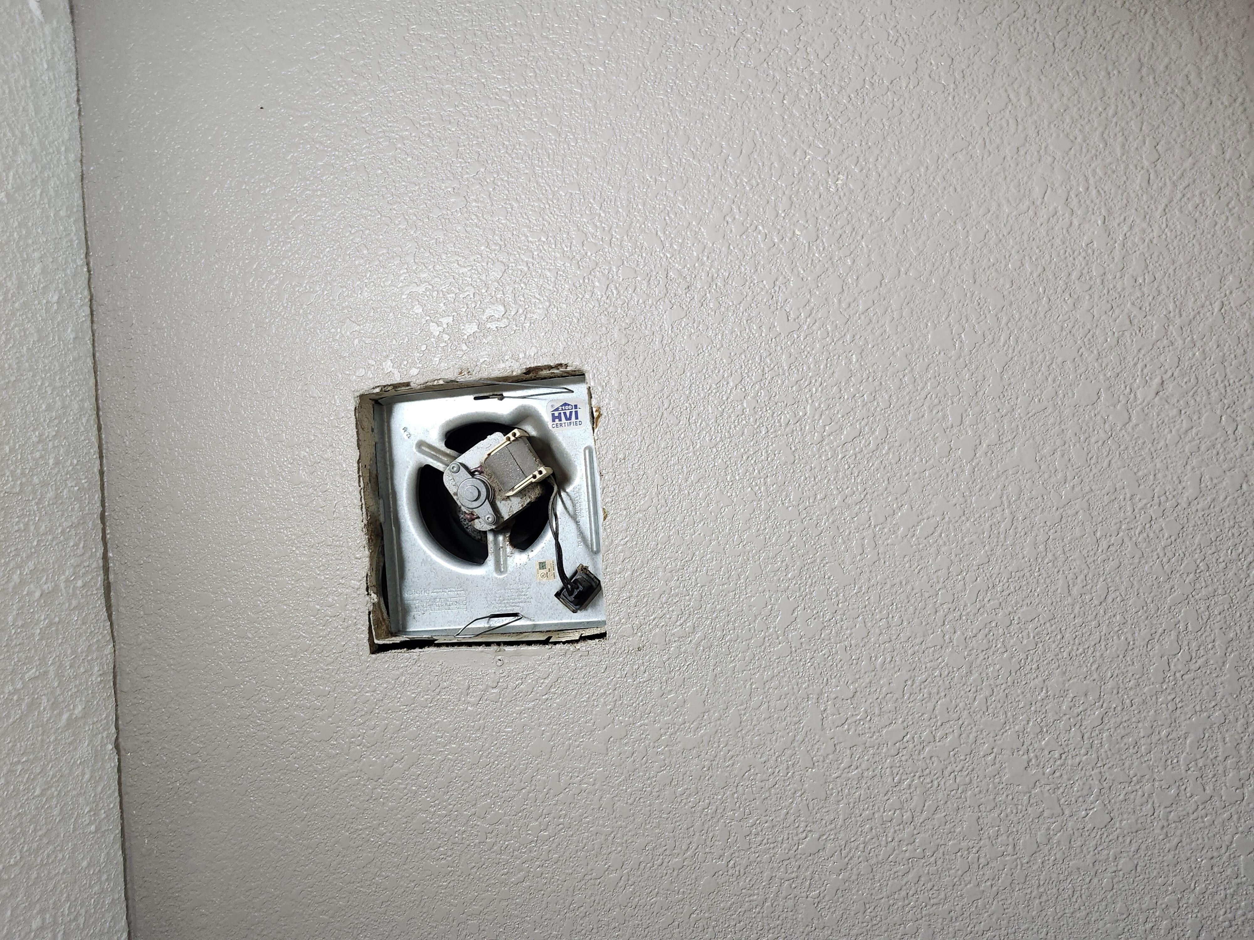 Hole in bathroom wall.