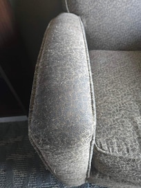 The chair was so dirty that it was disgusting to stand next to it.