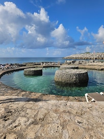 Access to the beach with plenty of lounging, and a lagoon for kids.