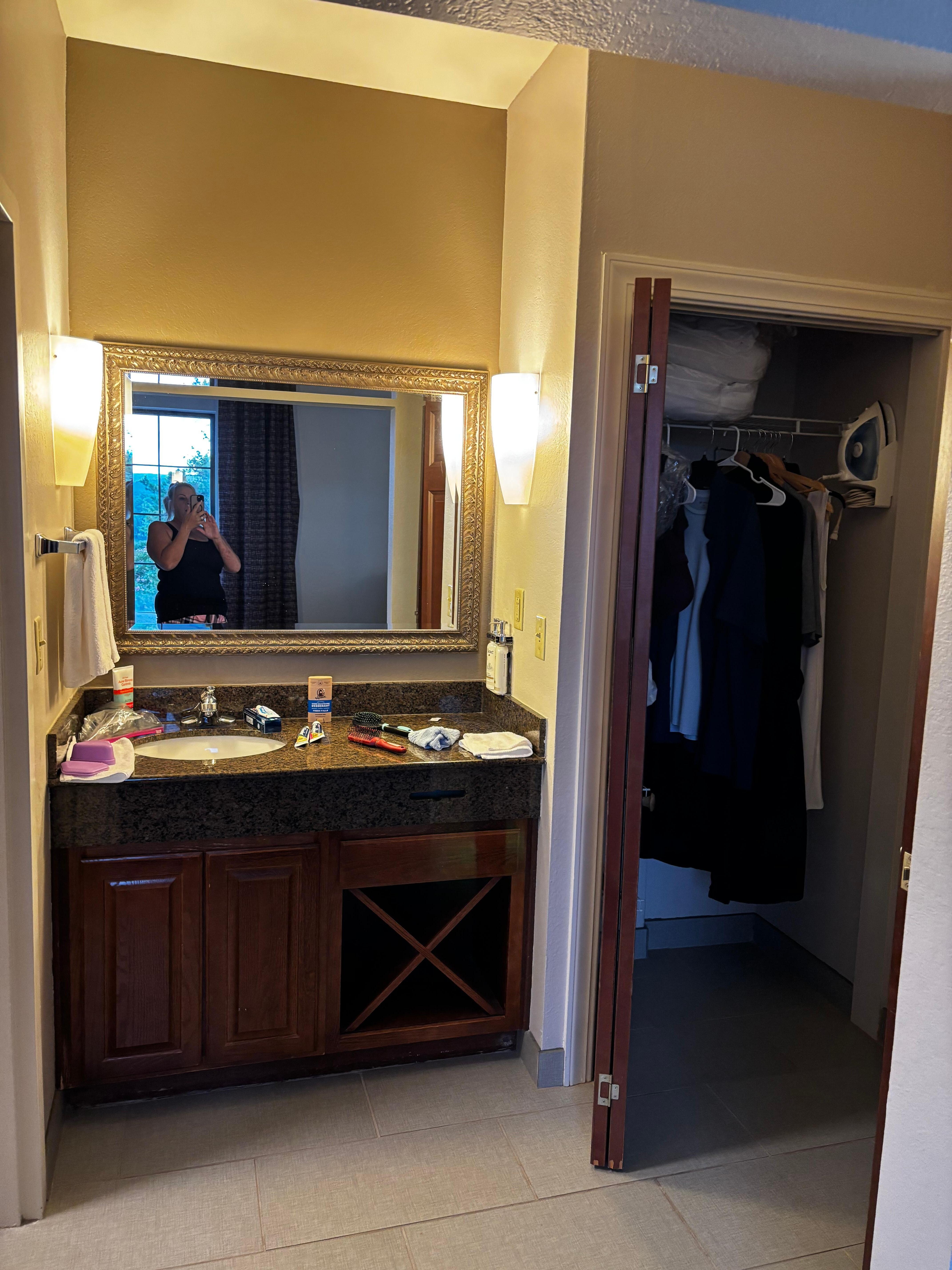 bathroom sink with a door to seprerate for privacy