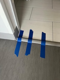 Tape down floor threshold.
