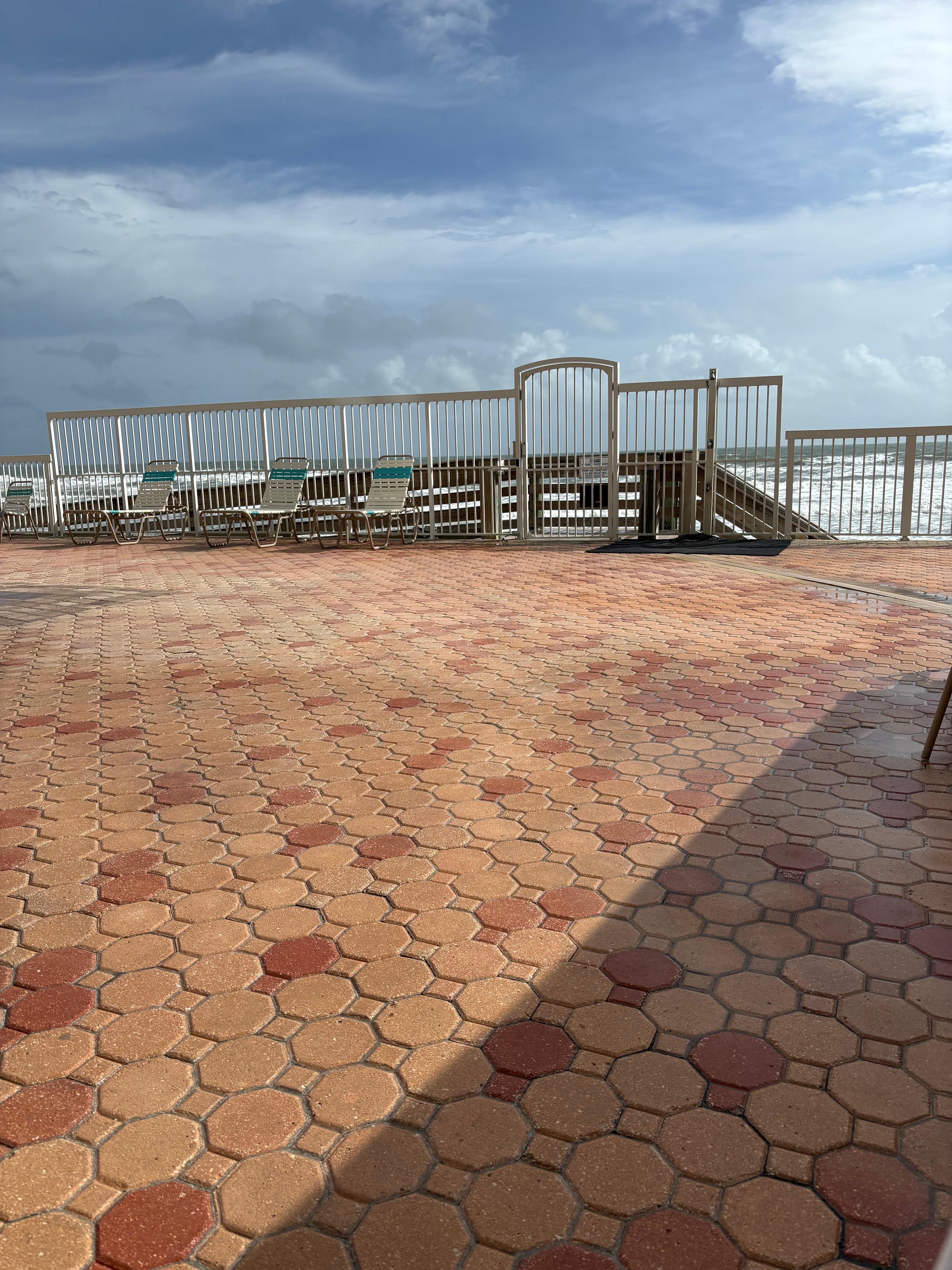 Sitting at the pool looking at beach entrance. 