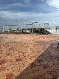 Sitting at the pool looking at beach entrance.
