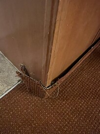 Carpeting tearing away from kitchen counter baseboard