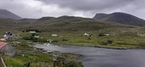 Pic of house from the road round the loch. (House is centre left in pic)