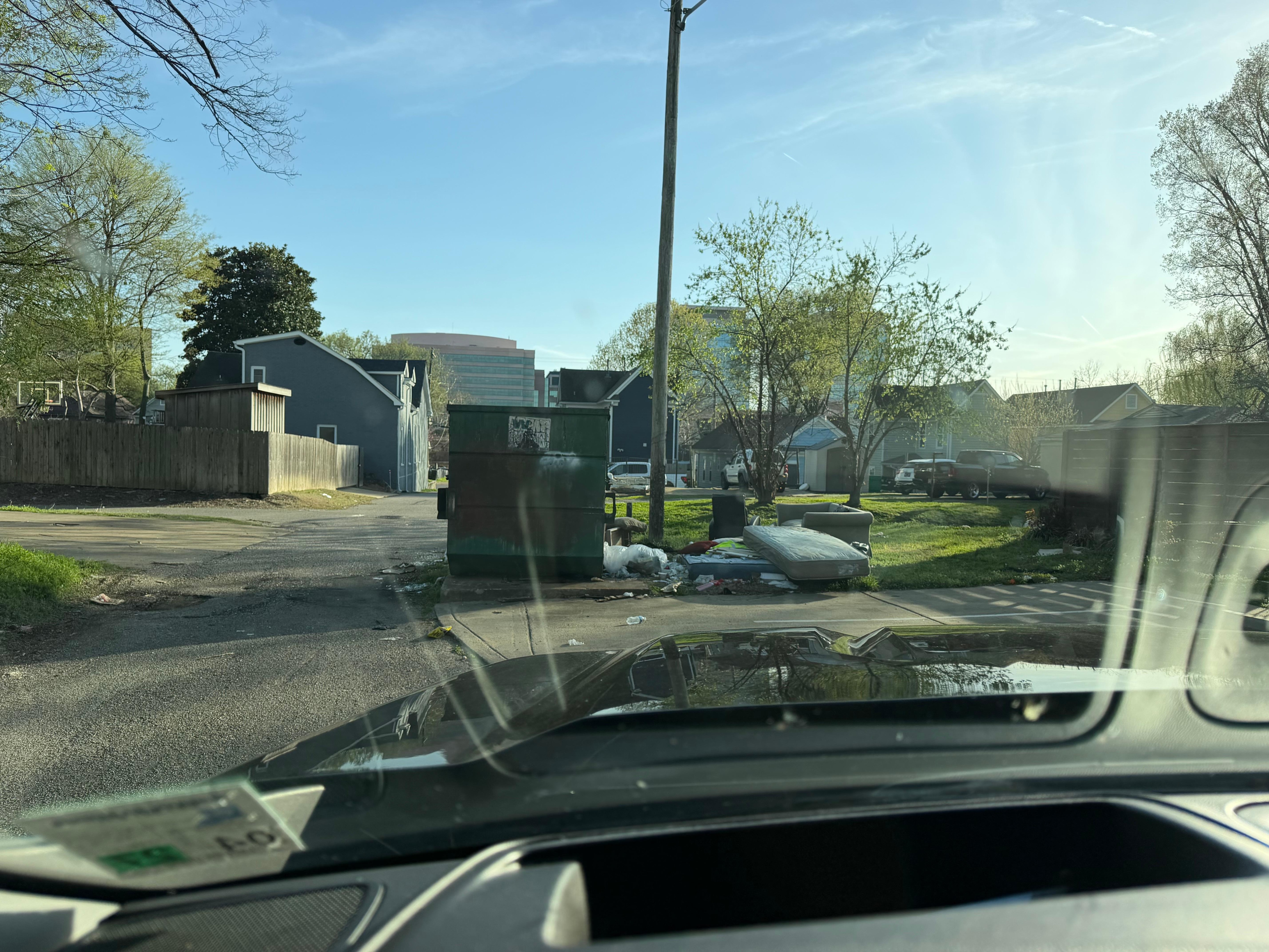 Trash dumpster at the stairs