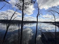 Sitting on the cliff on the lake