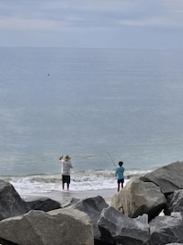 watching my husband and son fish from balcony