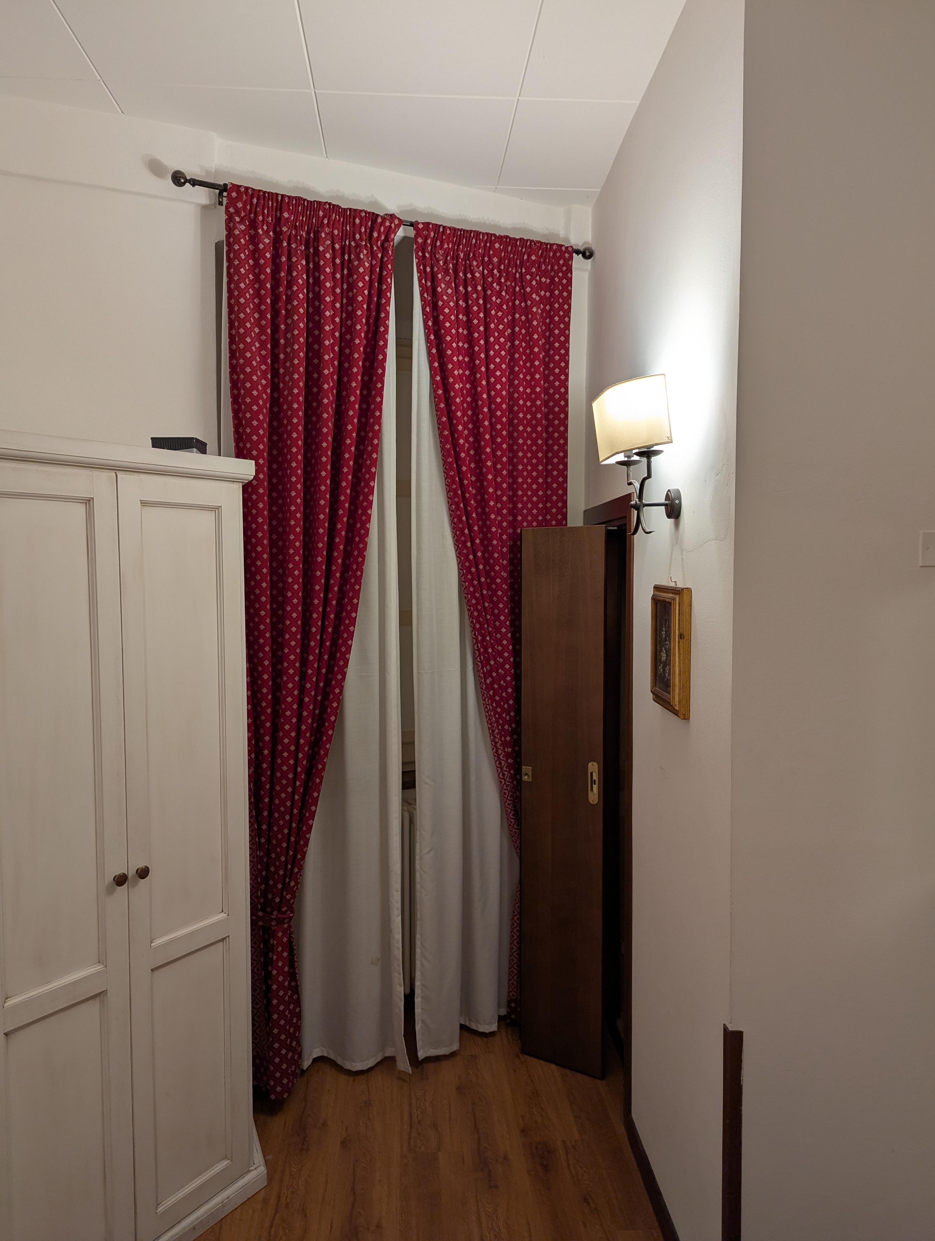 Door to bathroom which is away from view from the main room area.