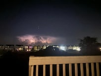 Watching a storm in the distance on the back deck!