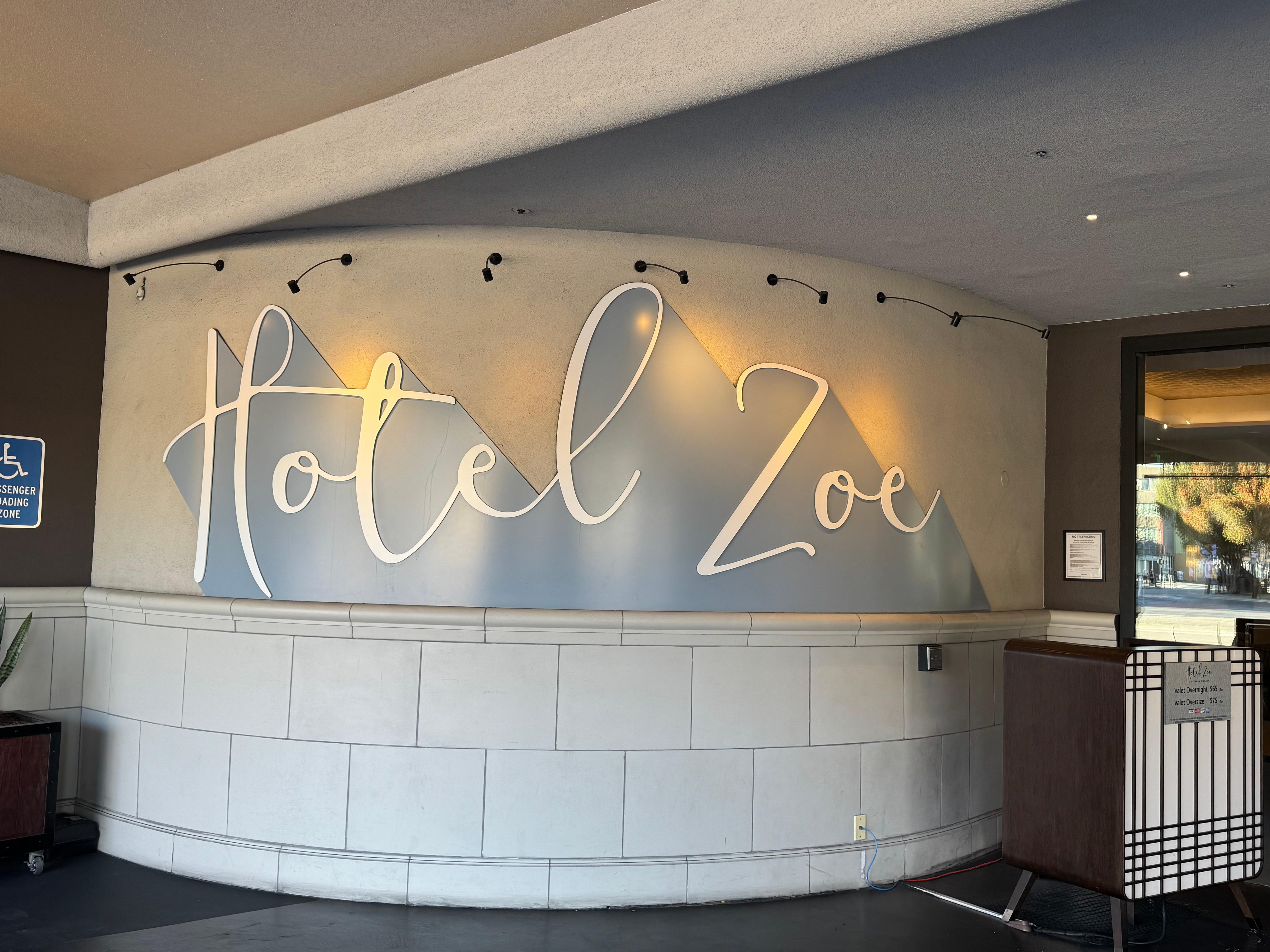Hotel sign outside front door 