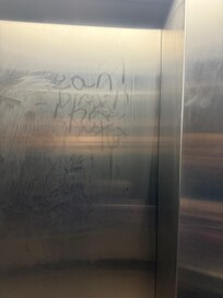 Even the elevator door hadn’t been cleaned in some time