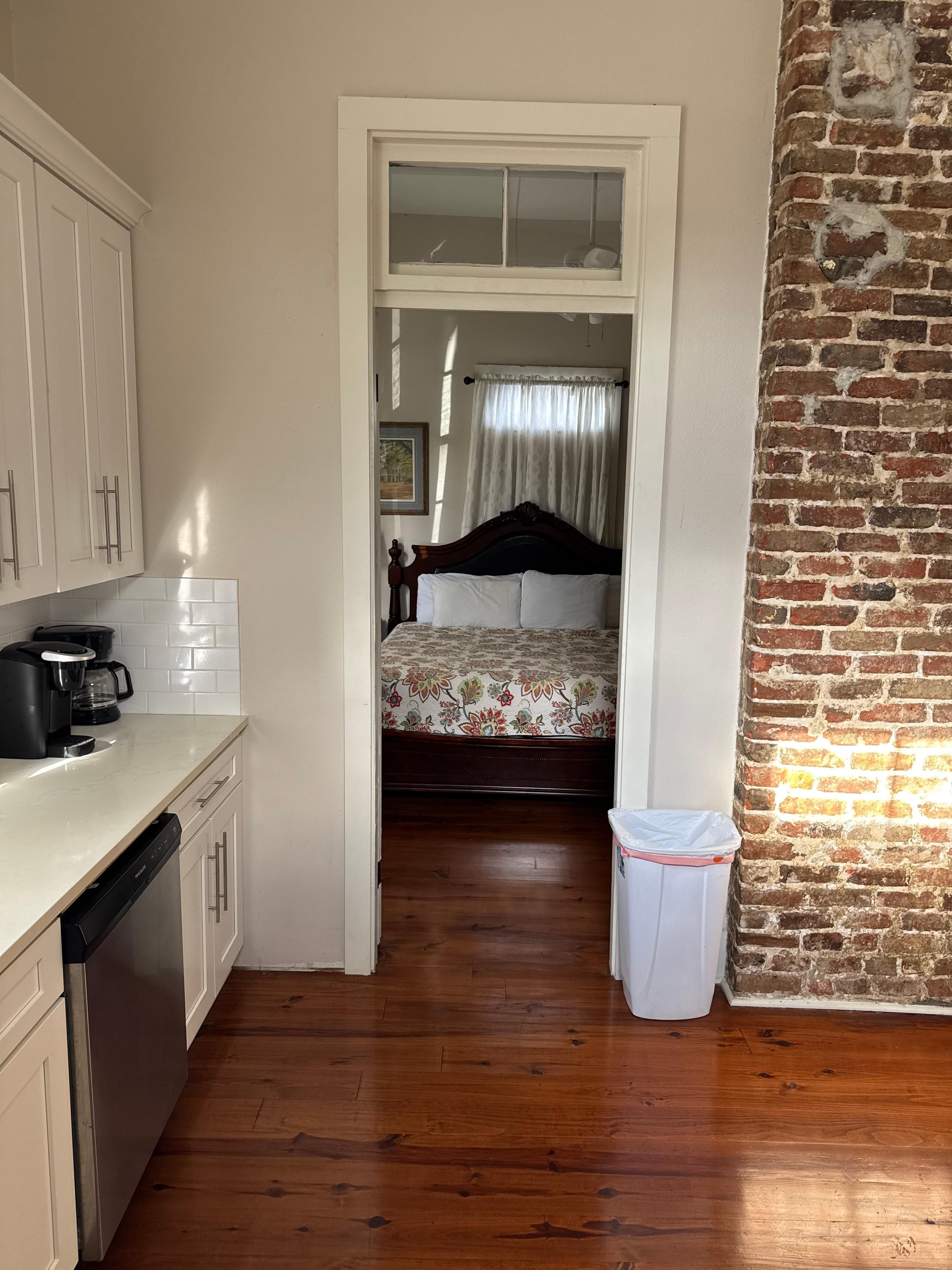 Kitchen looking into the first floor bedroom
