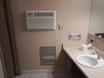 Nice sink and mirrors and ac heater old but works