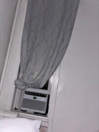 Had to ball up the curtain to access the one a/c unit in the apartment.
