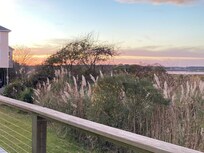 sitting on the deck at sunset
