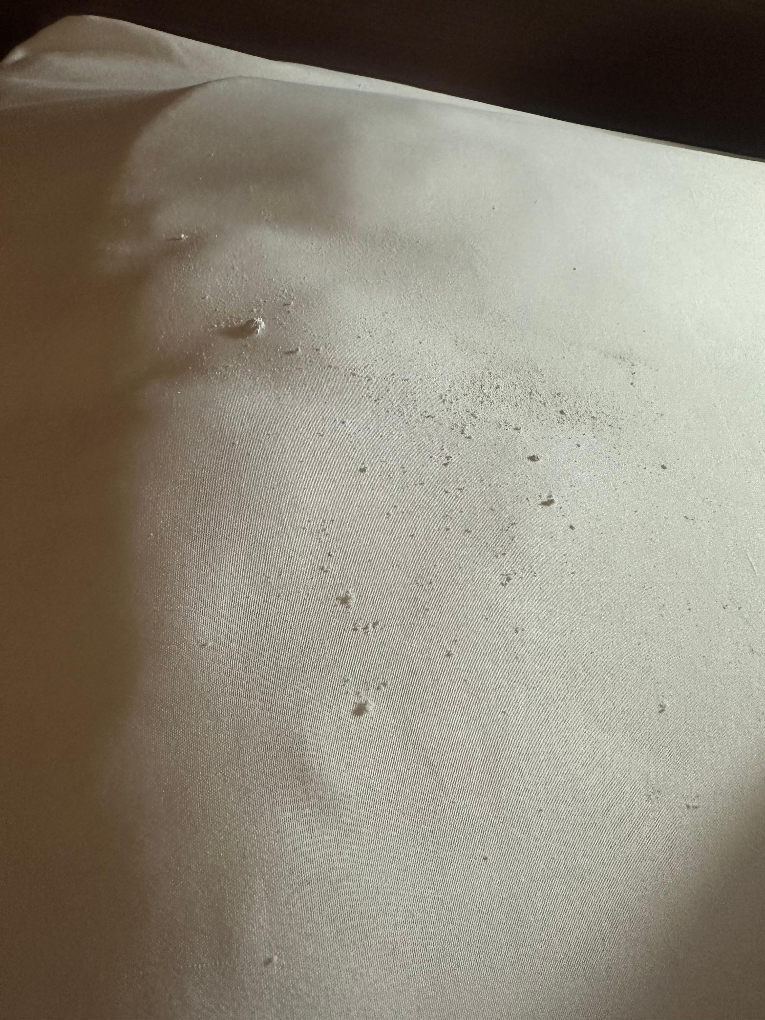White powder on the bed.
