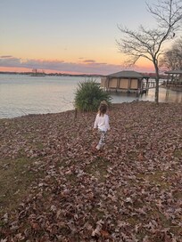 Beautiful winter sunset and our sweet granddaughter looking for leaves!