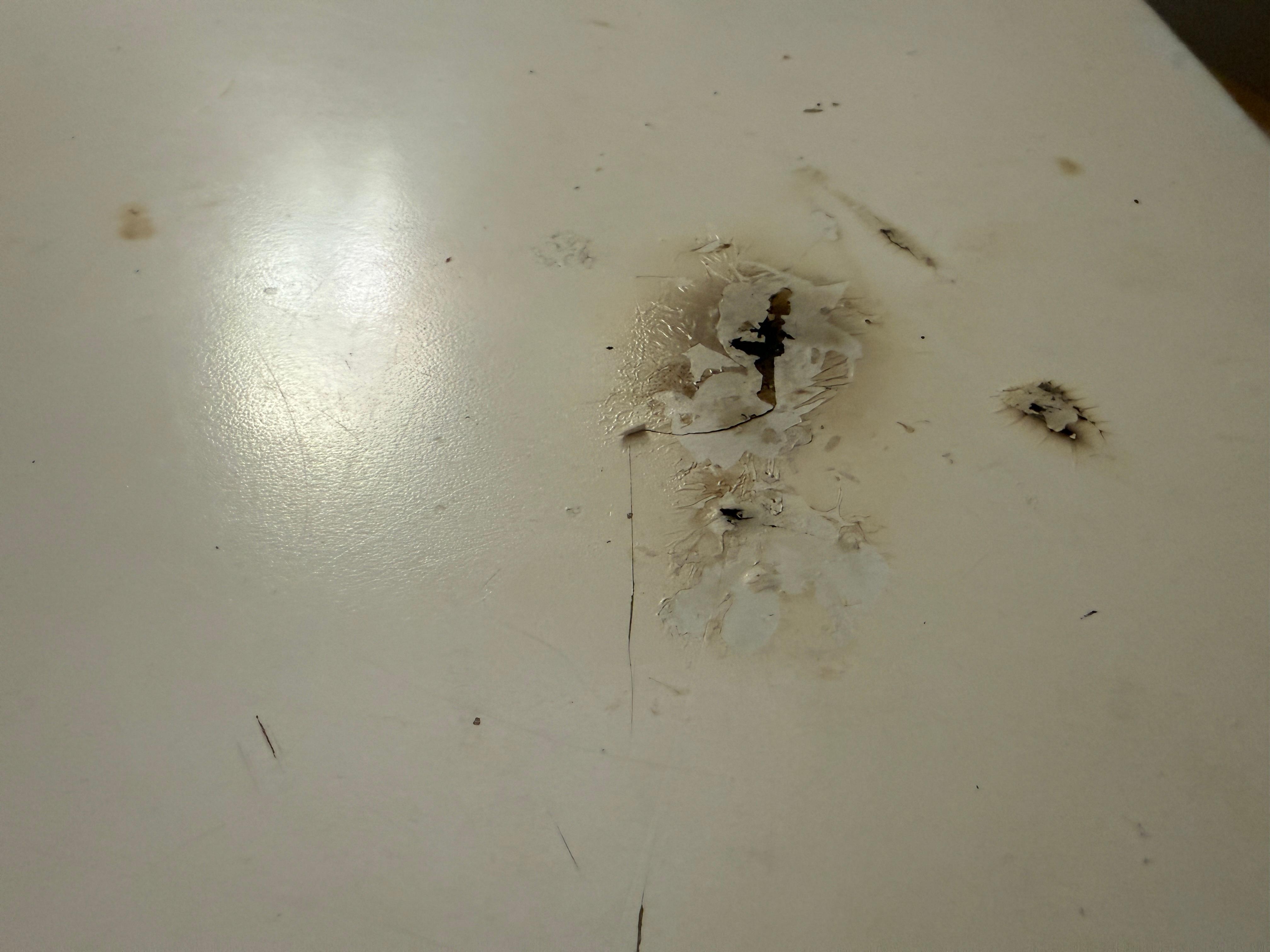 Cigarette burns on the furniture in a non-smoking room. 