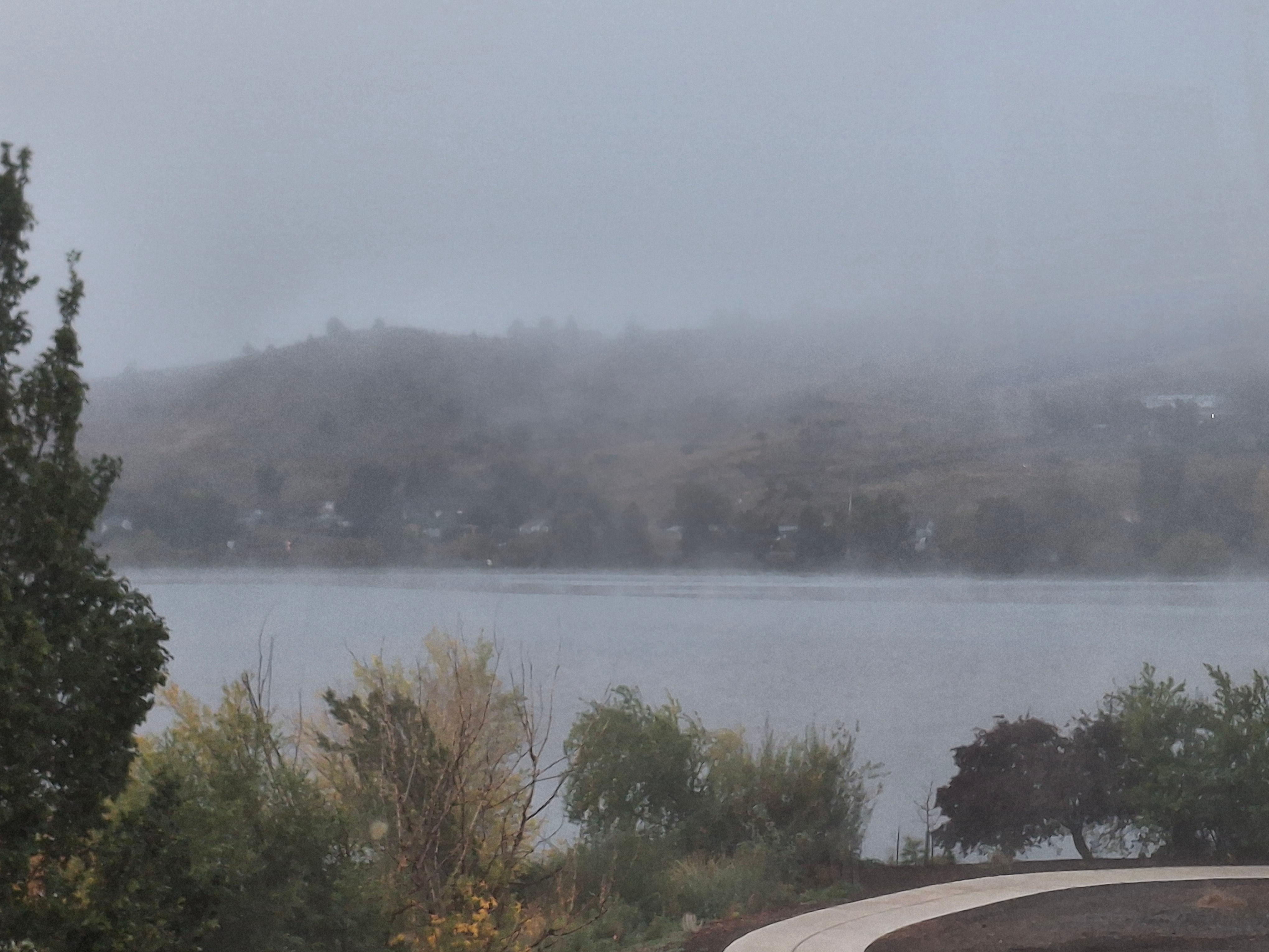 Fog on lake but you can see walking path 
