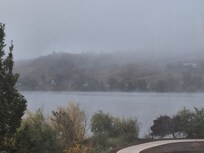Fog on lake but you can see walking path