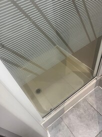 Shower tray from
80’s dirty grout,