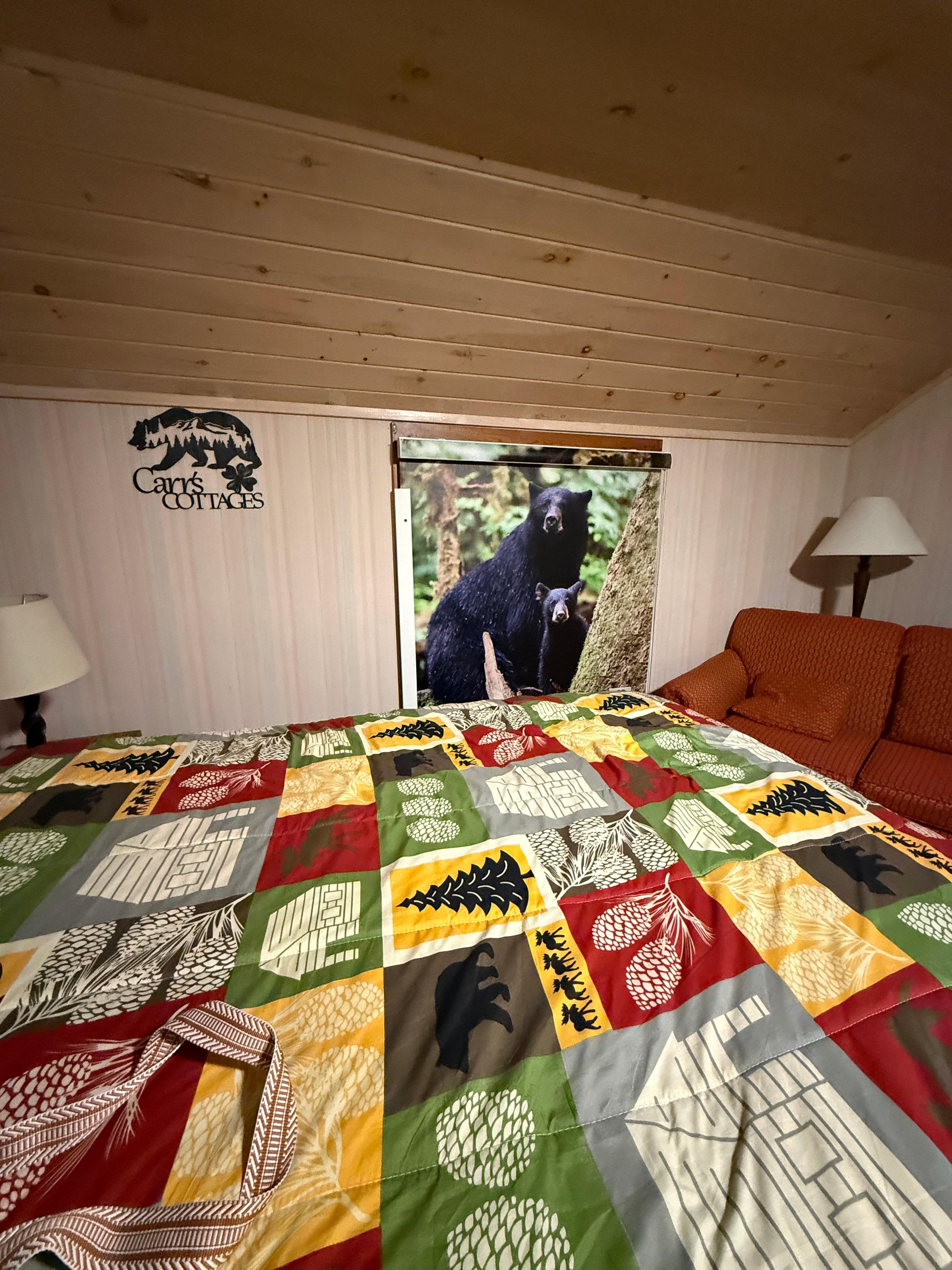 One of the beds and the window that overlooks the parking lot