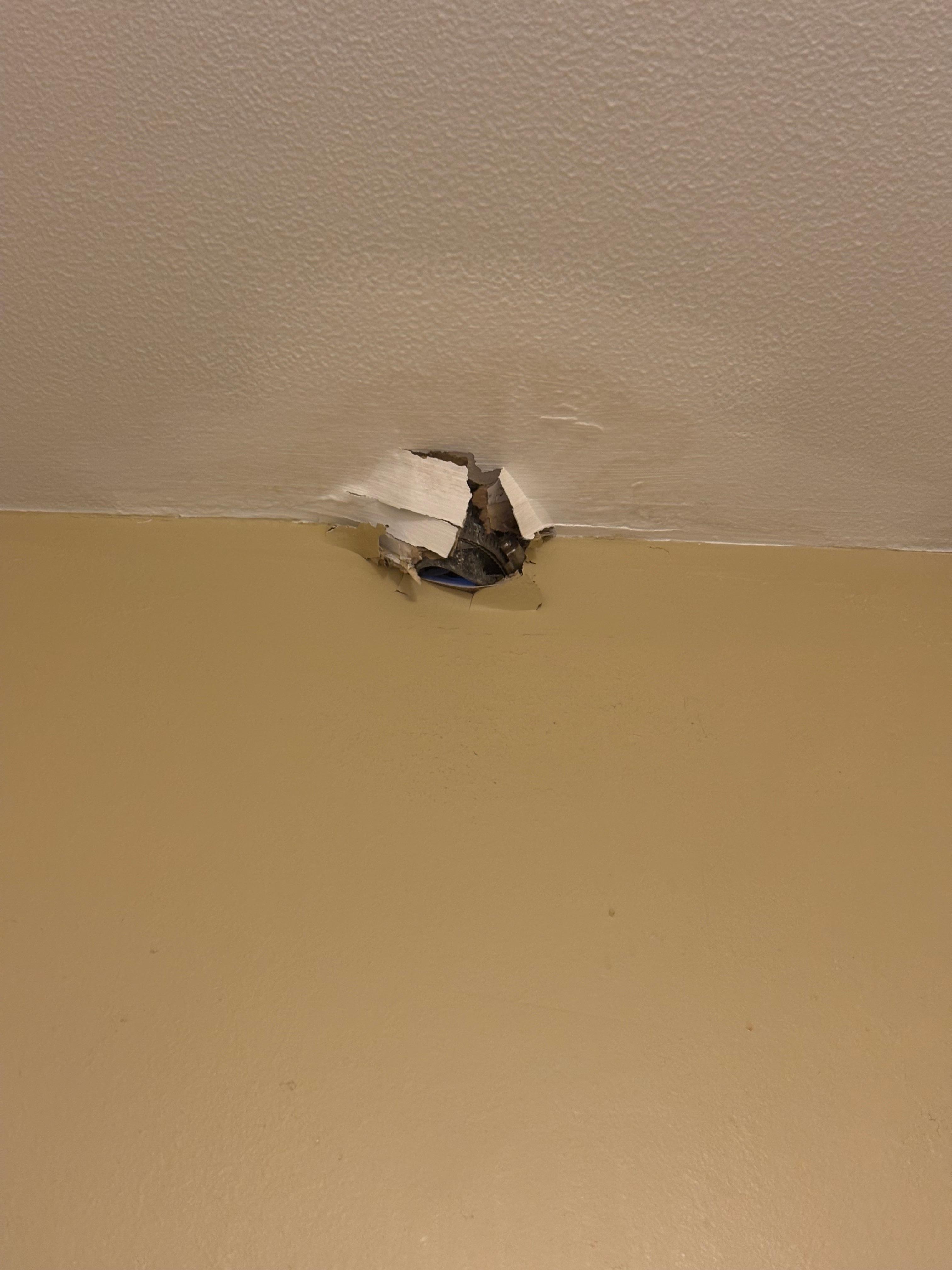 Hole from roofers in bathroom 