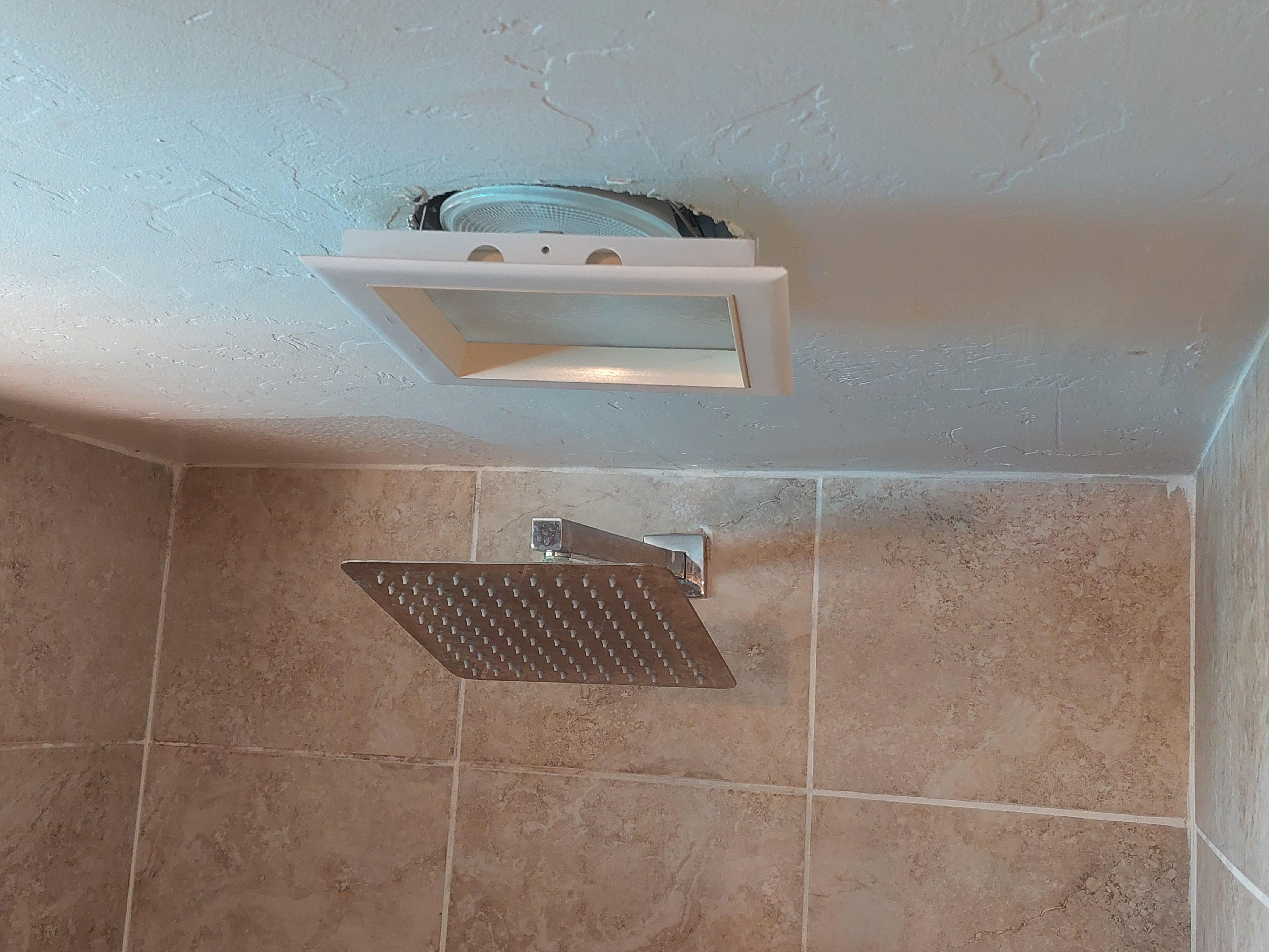 shower light that's hanging by wiring