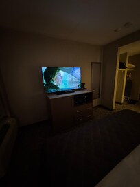 TV mini fridge and microwave below tv