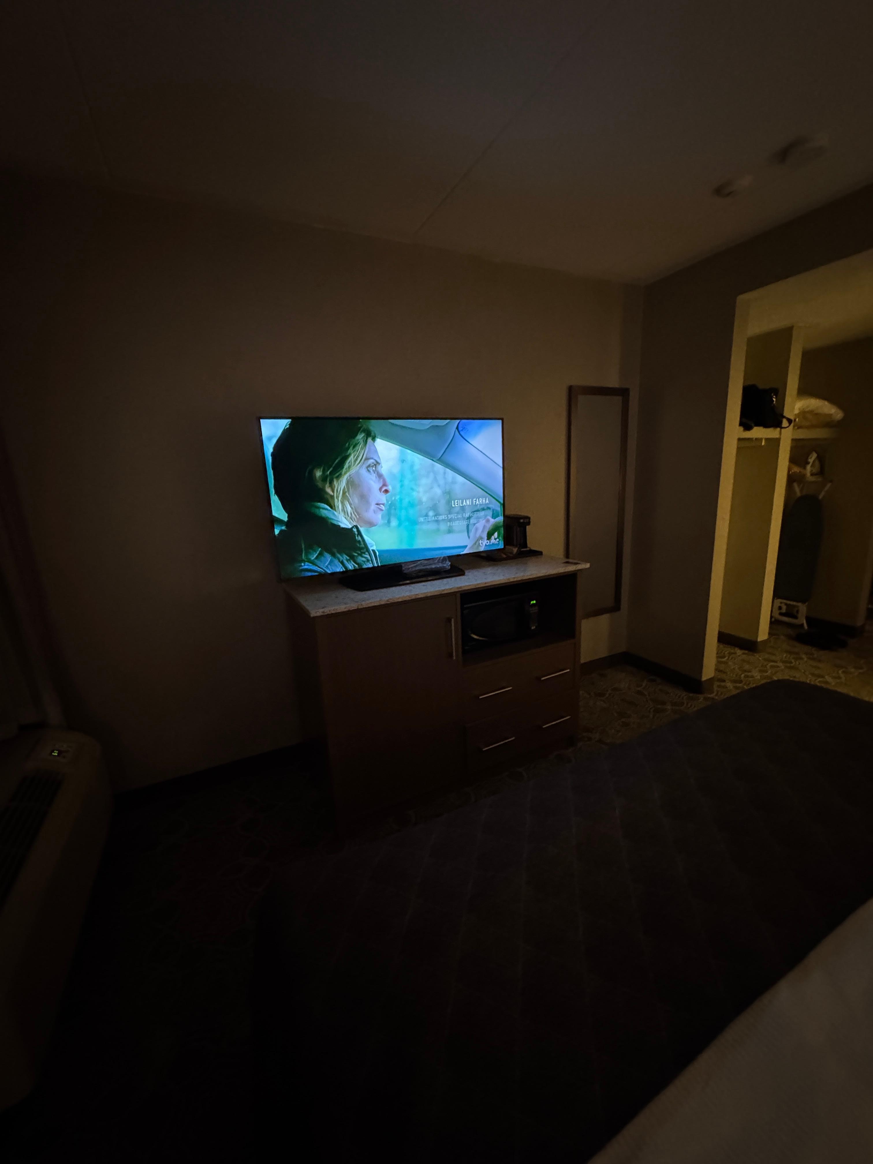 TV mini fridge and microwave below tv
